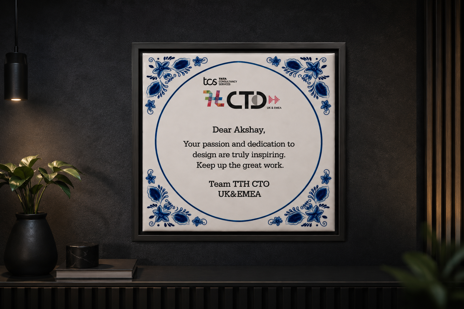 Recognition plaque from the TCS CTO UK & EMEA team mounted on a dark gallery wall
